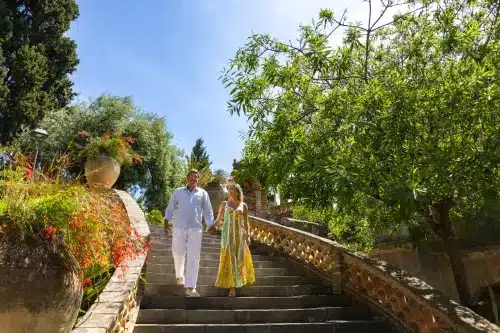 roposal photographer in Taormina capturing a surprise engagement in the public garden.