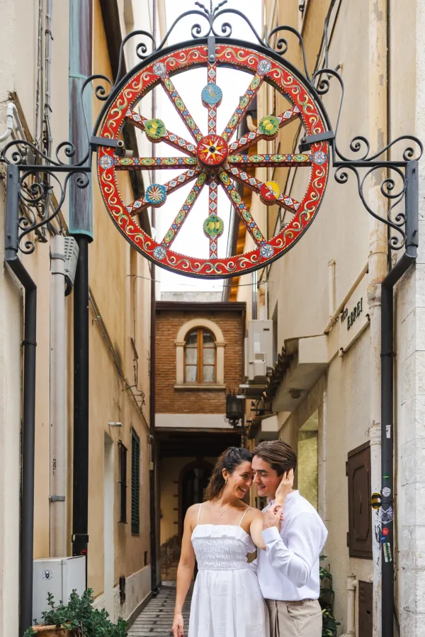 023-bride-to-be-smiling-in-white-dress-during-taormina-engagement