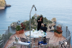 Couple walking down to the terrace for their wedding proposal Isola Bella