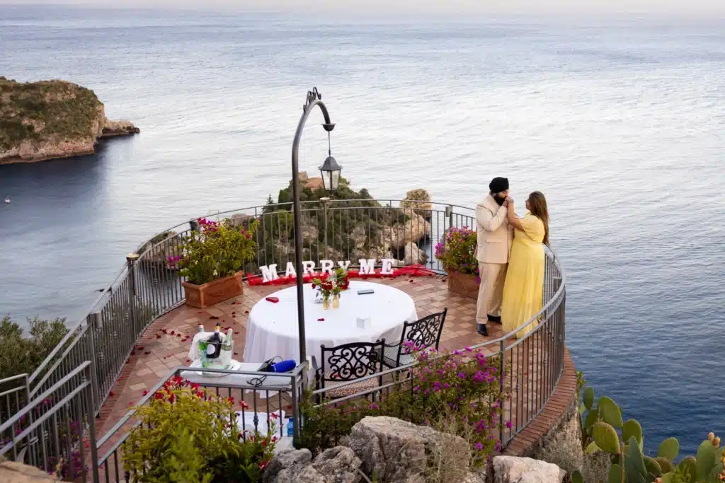 Romantic proposal overlooking the sea. Indian marriage proposal in taormina