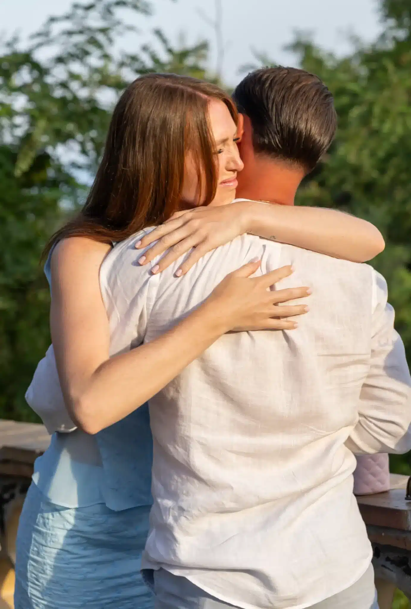 couple emotional embrace after proposal Taormina